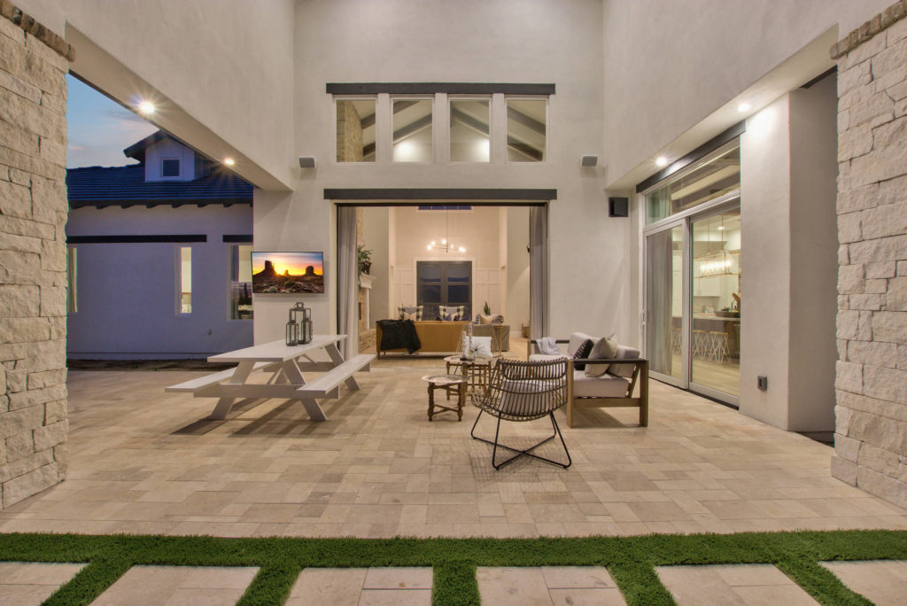 Modern-Farmhouse-Design-Featuring-Sliding-Glass-Wall-to-Courtyard-Patio